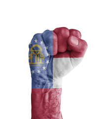Flag of US Georgia state painted on human fist like victory symbol