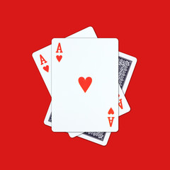 Ace playing cards on red background
