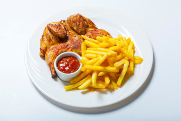 fried chicken with fries on white plate