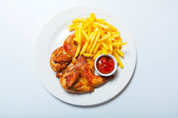 fried chicken with fries on white plate