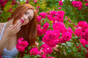 Naklejka premium Beautiful and nice redhead woman in white hat in vacation spending a good time. Girl in white and pink light blue tones at clothes 