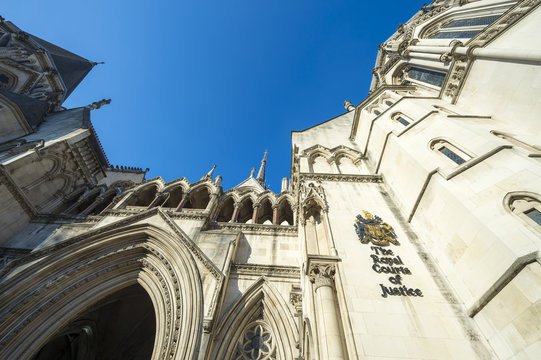 The Victorian Gothic style main entrance to the The Royal Courts of Justice public building in London, UK