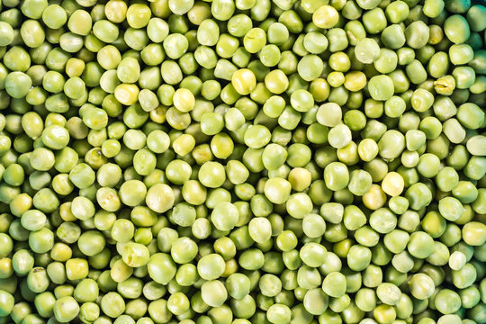 Flat lay raw green peas abstract background