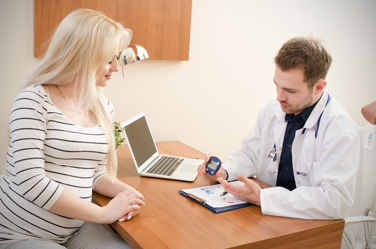 Doctor measuring of blood sugar for diabetes patient