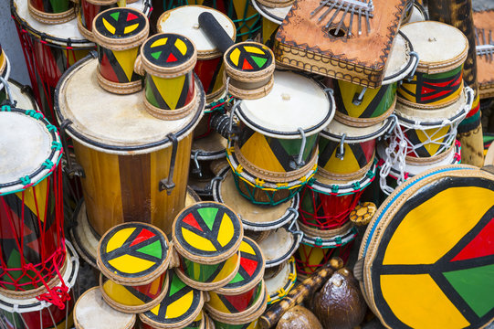 Afro-Brazilian drums and musical instruments stacked up in historic tourist district of Pelourinho, Salvador, Brazil.