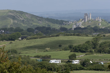 Fototapeta na wymiar Campsite in the Dorset countryside overlooked by Corfe Castle. England UK 2017