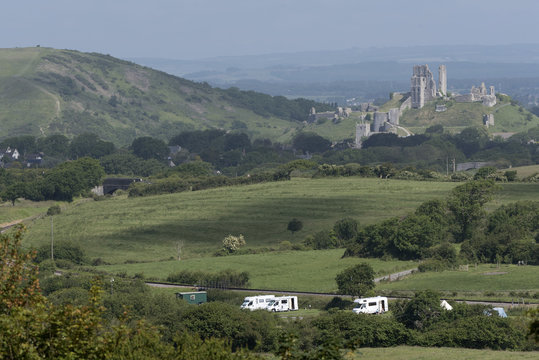 Campsite in the Dorset countryside overlooked by Corfe Castle. England UK 2017