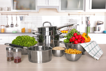 Utensils for cooking classes on table in kitchen