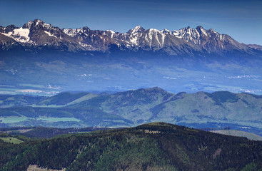 Highest summits of High Tatras, the Carpathians and Slovakia: Gerlachovsky, Ladovy and Lomnicky peaks, in a sunny spring day from Kralova Hola peak, Low Tatras, Slovakia, Europe © nogreenabove2k
