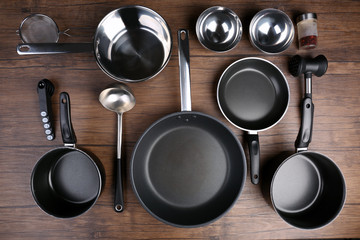 Kitchen utensils for cooking classes on wooden background