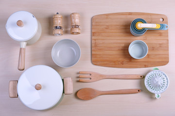 Kitchen utensils for cooking classes on wooden background