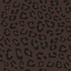 Seamless realistic animal pattern. Imitation of skin of black leopard, panther. Black and grey spots on brown background. © olkita