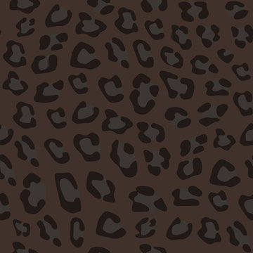 Seamless realistic animal pattern. Imitation of skin of black leopard, panther. Black and grey spots on brown background.
