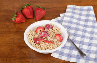 Fresh Strawberries on Oat Cereal with Milk