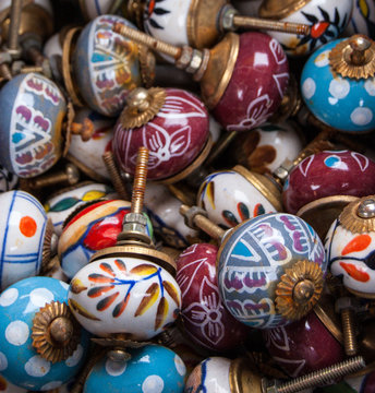 Old ornate knobs background. Closeup.