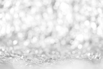 Defocused lights abstract grey round bokeh from aluminum foil background