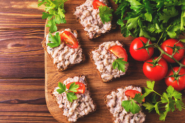 Toast with kosher Forshmak paste, parsley and cherry tomatoes