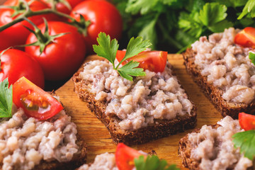 Toast with kosher Forshmak paste, parsley and cherry tomatoes
