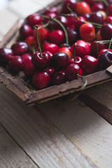Cherry berries are fresh on a wooden background. Concept of health.