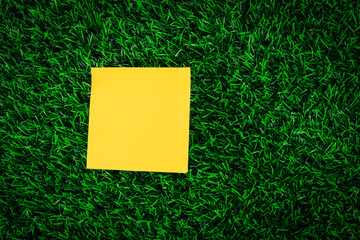 paper Post-it on grass