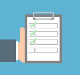 Hand holding clipboard with checklist on it