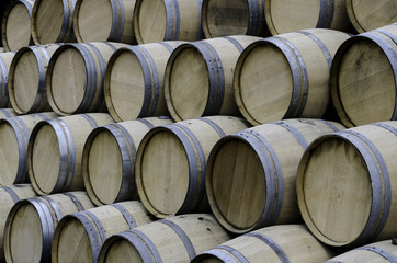 wooden barrels at the distiiery - 159842264