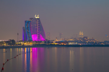 DUBAI, UAE - MARCH 30, 2017: The evening skyline with the Jumeirah Beach Hotel.