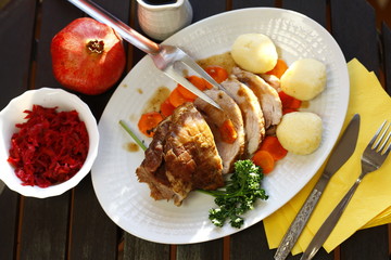 roast meat with dumplings, carrots and red cabbage