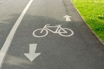 Fototapeta premium A cycling lane sign on the ground