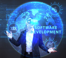 The concept of business, technology, the Internet and the network. A young entrepreneur working on a virtual screen of the future and sees the inscription: Software development