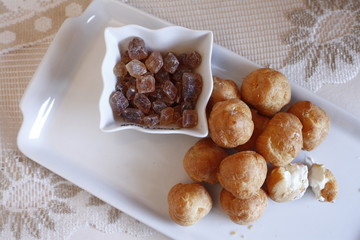 traditional carnival food served on a white plate with candy cane