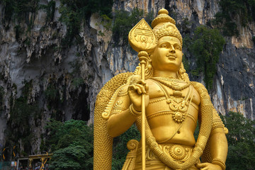 golden Lord Murugan statue at Batu Caves in Malaysia