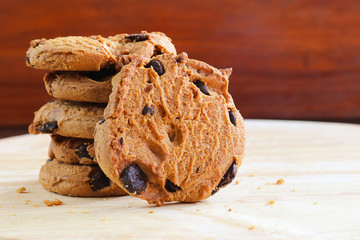 traditional chocolate chips cookies on wooden background