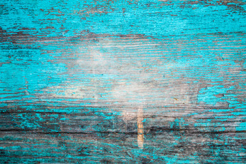 Wooden wall , cracked blue paint