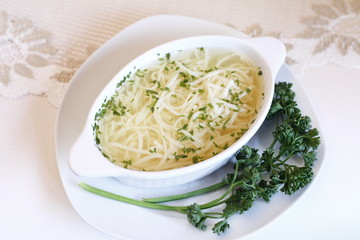 Delicious wedding soup in a white plate from above isolated