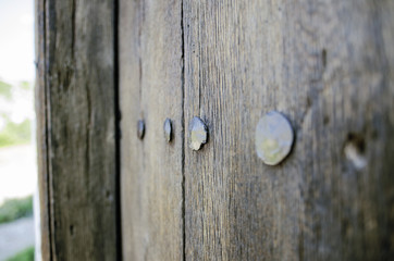 Old Wooden Door With Big Metal Nails Closeup Shot