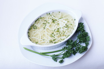 Delicious wedding soup in a white plate from above isolated