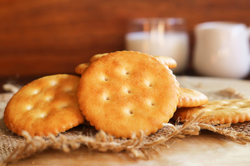 butter biscuits cracker and milk set up on wooden background