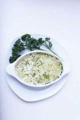 Delicious wedding soup in a white plate from above isolated