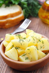 Boiled potatoes with dill and oil