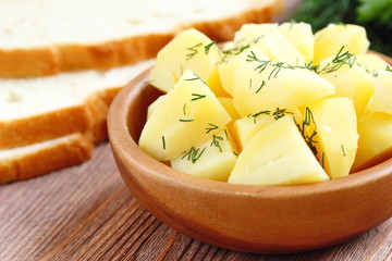 Boiled potatoes with dill and oil
