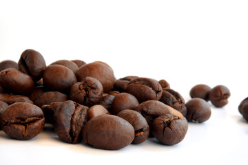 Coffee beans closeup isolated on white background