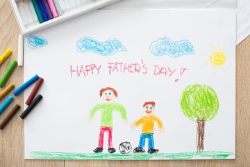 Children pastel drawing of happy father with son.