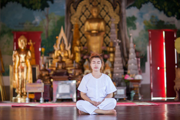 Buddhist Nuns meditation on the temple of thailand