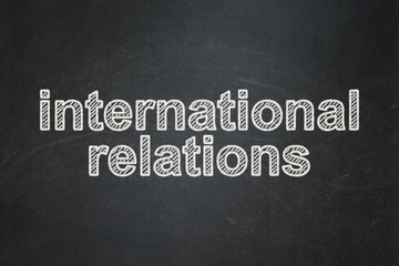 Politics concept: International Relations on chalkboard background