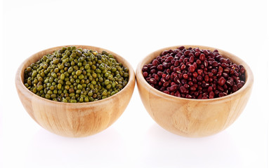 Green beans, red beans wooden bowls on white background