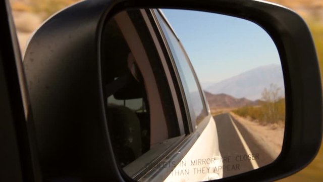 Death Valley National Park filmed though a car mirror.