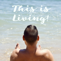 man on the beach and text this is living