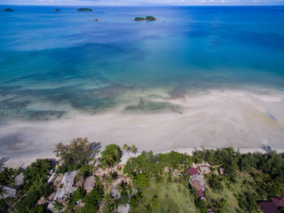 Aerial view of beach and small islands in blue sea