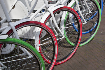 Fototapeta na wymiar White bicycles with colorful tires